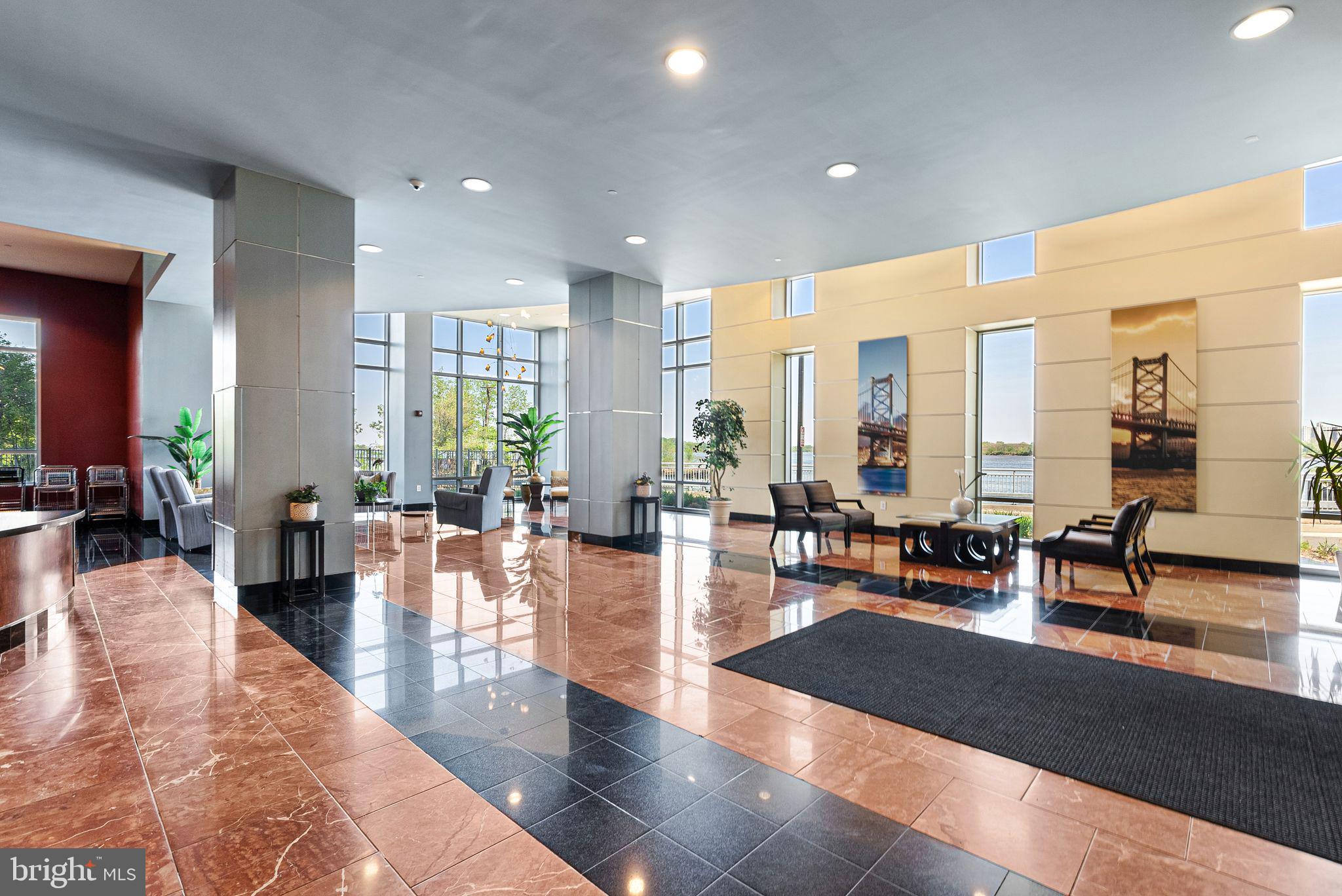 901 North Penn Street, Unit R2203 Philadelphia, PA 19123 - Photo 41 of 58 a living room with furniture and view of kitchen