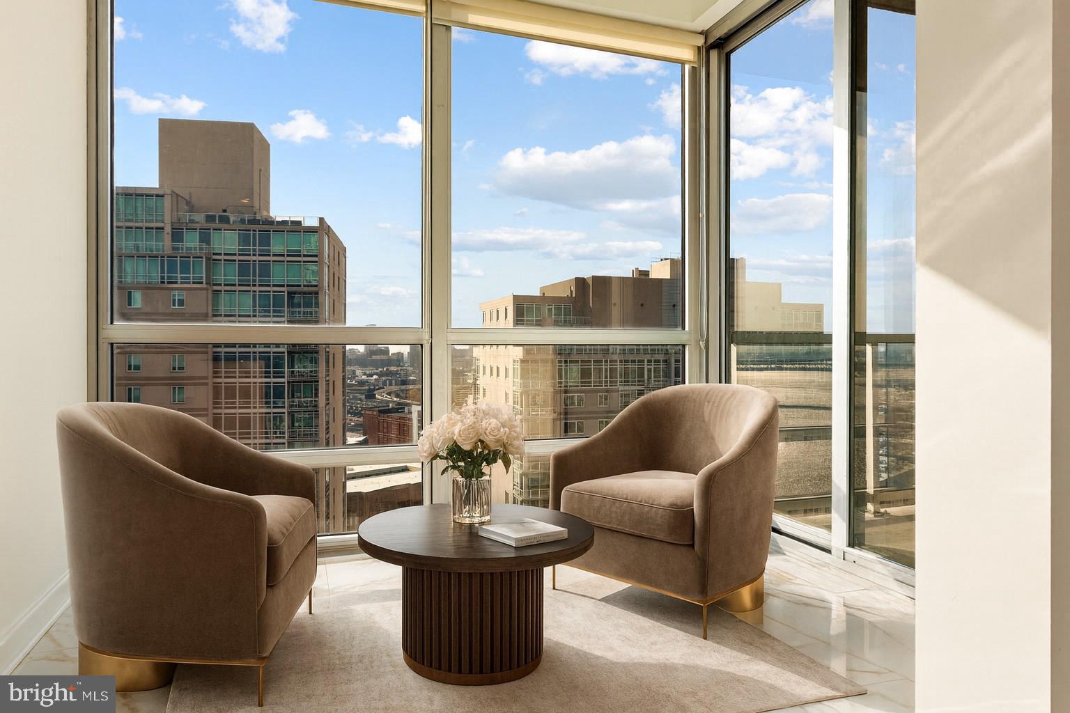 901 North Penn Street, Unit R2203 Philadelphia, PA 19123 - Photo 5 of 58 a living room with furniture a lamp and a potted plant