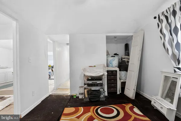 a view of hallway with sink and a closet