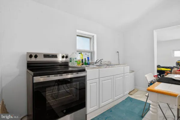 a view of kitchen with cabinets