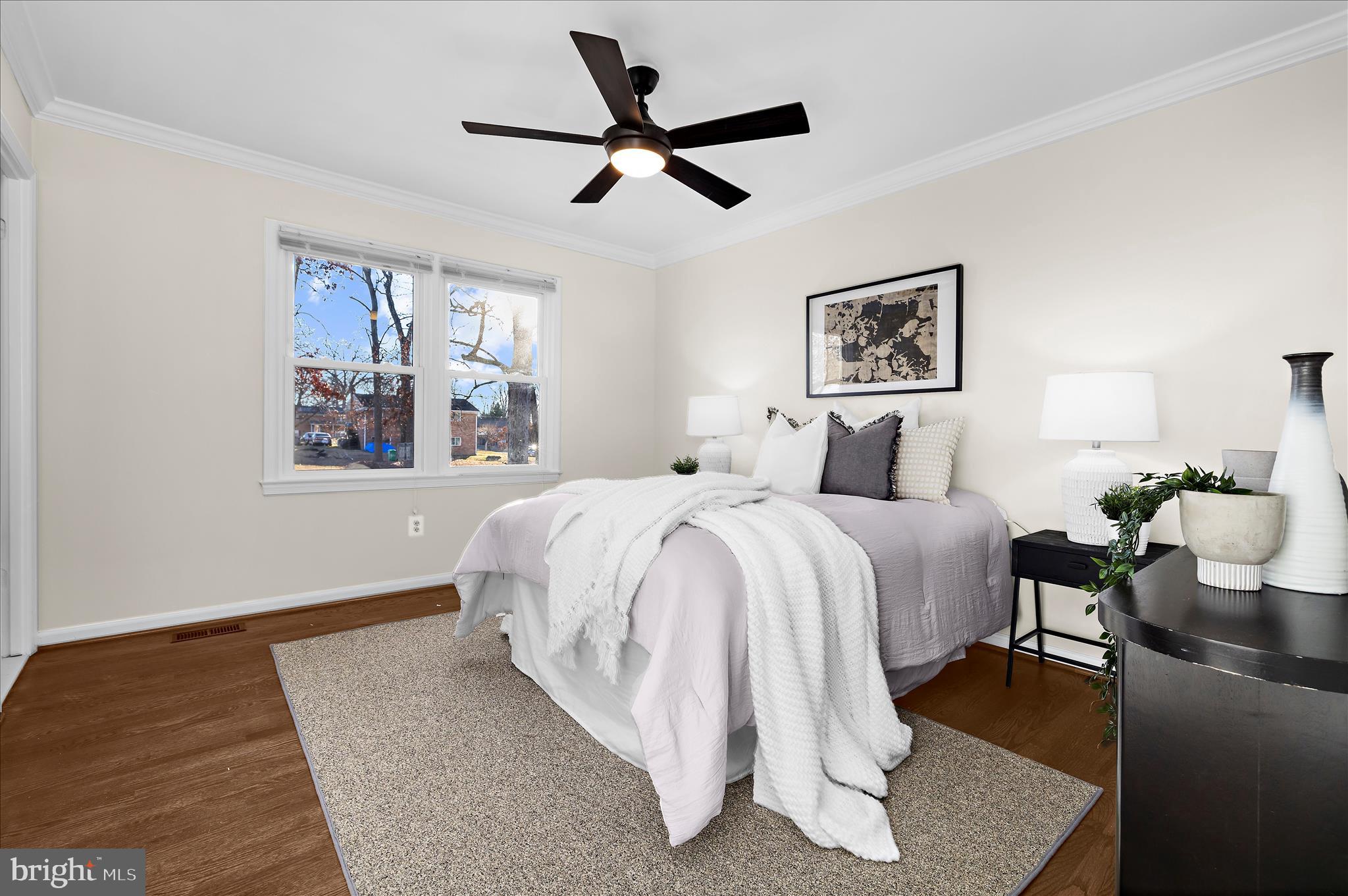 9008 Townsend Lane Clinton, MD 20735 - Photo 15 of 48 a bedroom with a bed and wooden floor