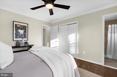 a bedroom with a large bed and a window