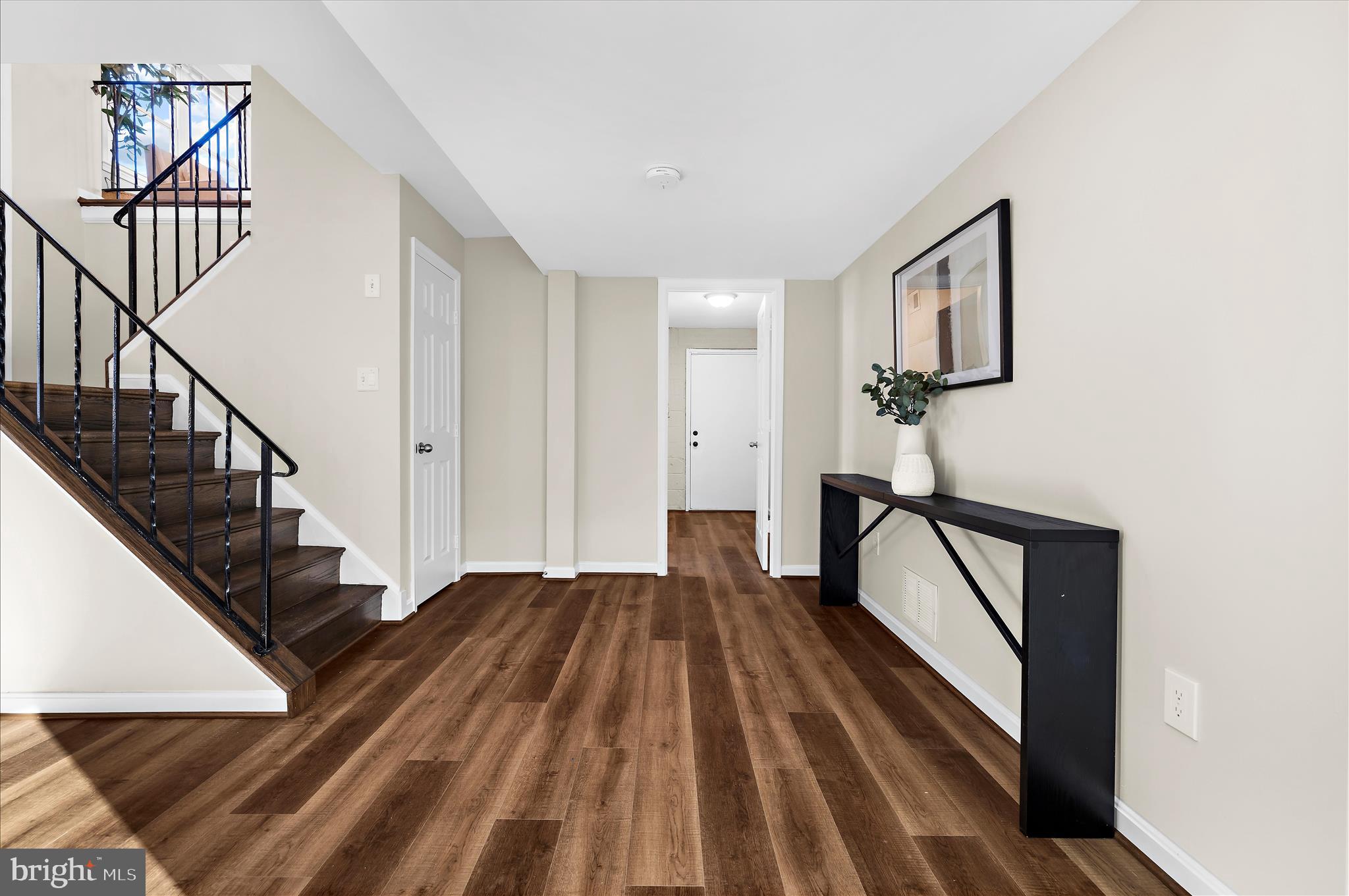 9008 Townsend Lane Clinton, MD 20735 - Photo 31 of 48 a view of entryway and hall with wooden floor