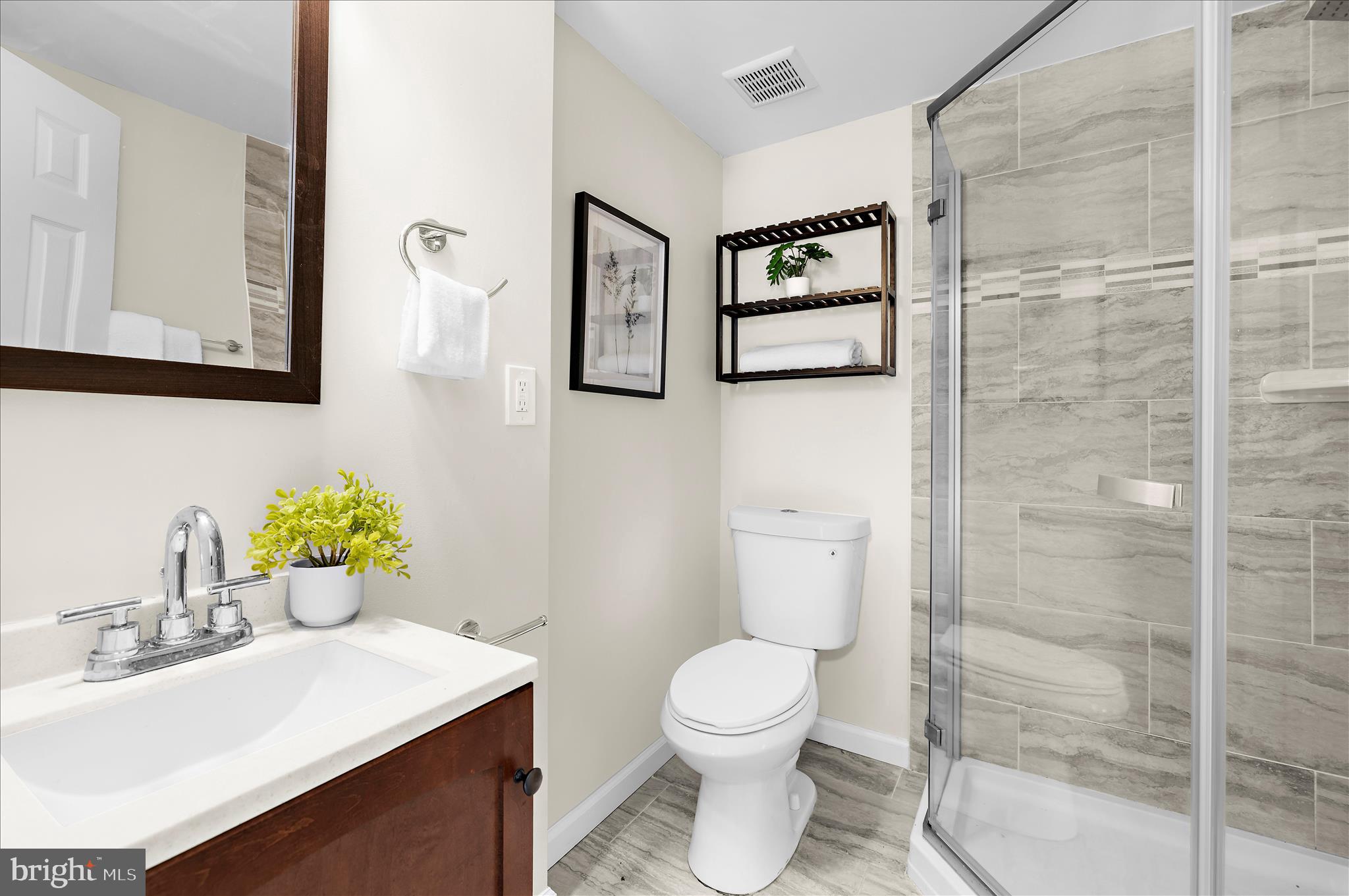 9008 Townsend Lane Clinton, MD 20735 - Photo 34 of 48 a bathroom with a sink mirror and toilet