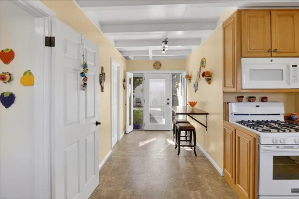a kitchen with stainless steel appliances granite countertop a stove and a refrigerator