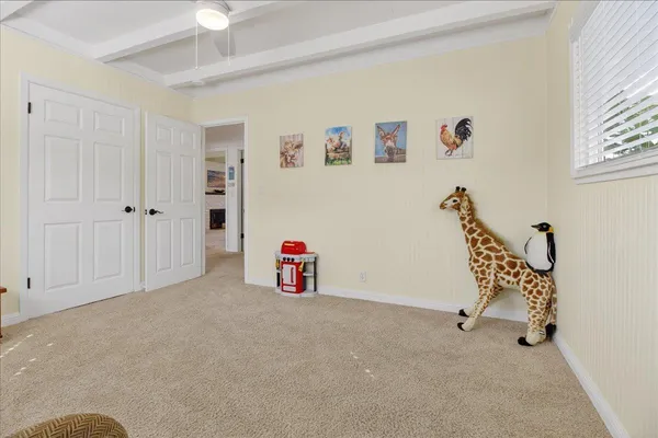 a view of a livingroom with furniture and a window