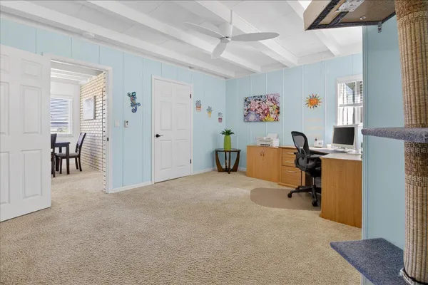 an empty room with closet and mirrors