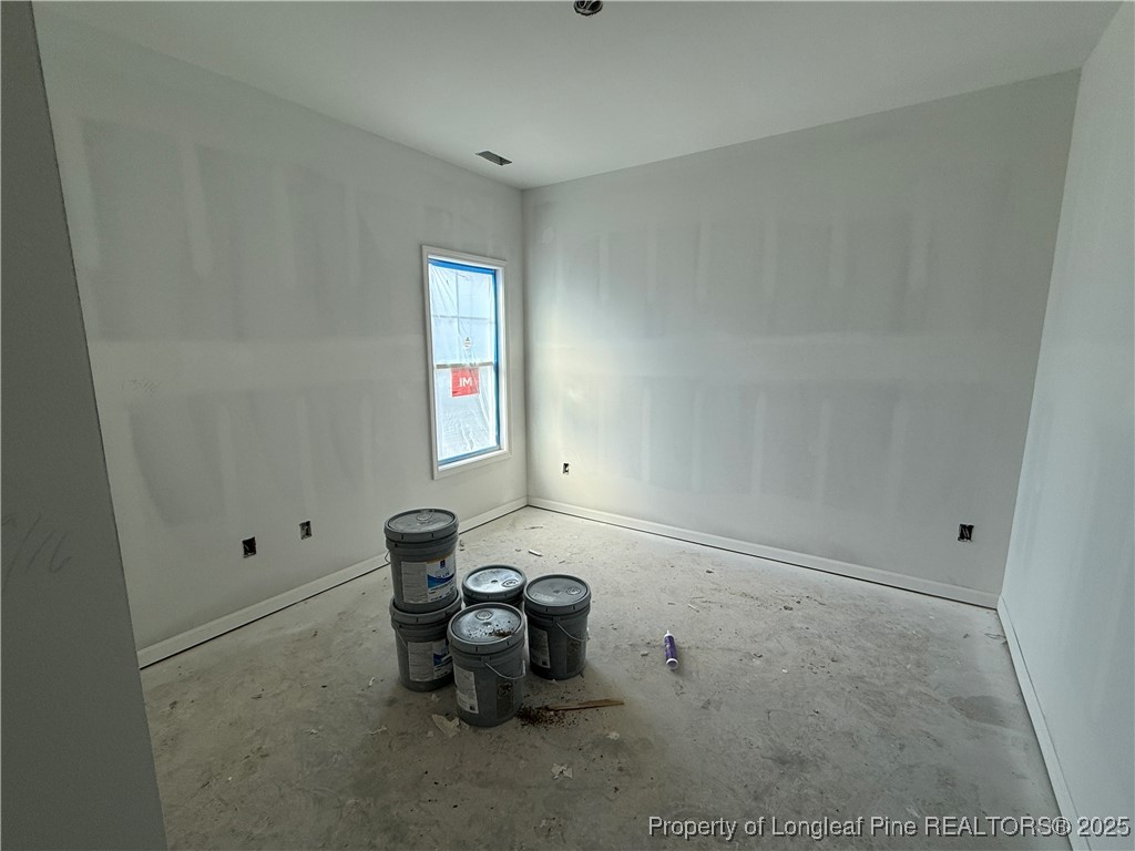 415 Traveller Way Raeford, NC 28376 - Photo 11 of 18 a room with workbench and window