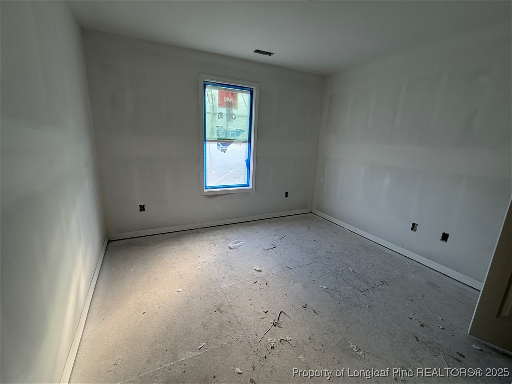 415 Traveller Way Raeford, NC 28376 - Photo 14 of 18 a view of an empty room with a window