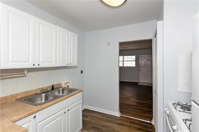 a kitchen with a sink and cabinets