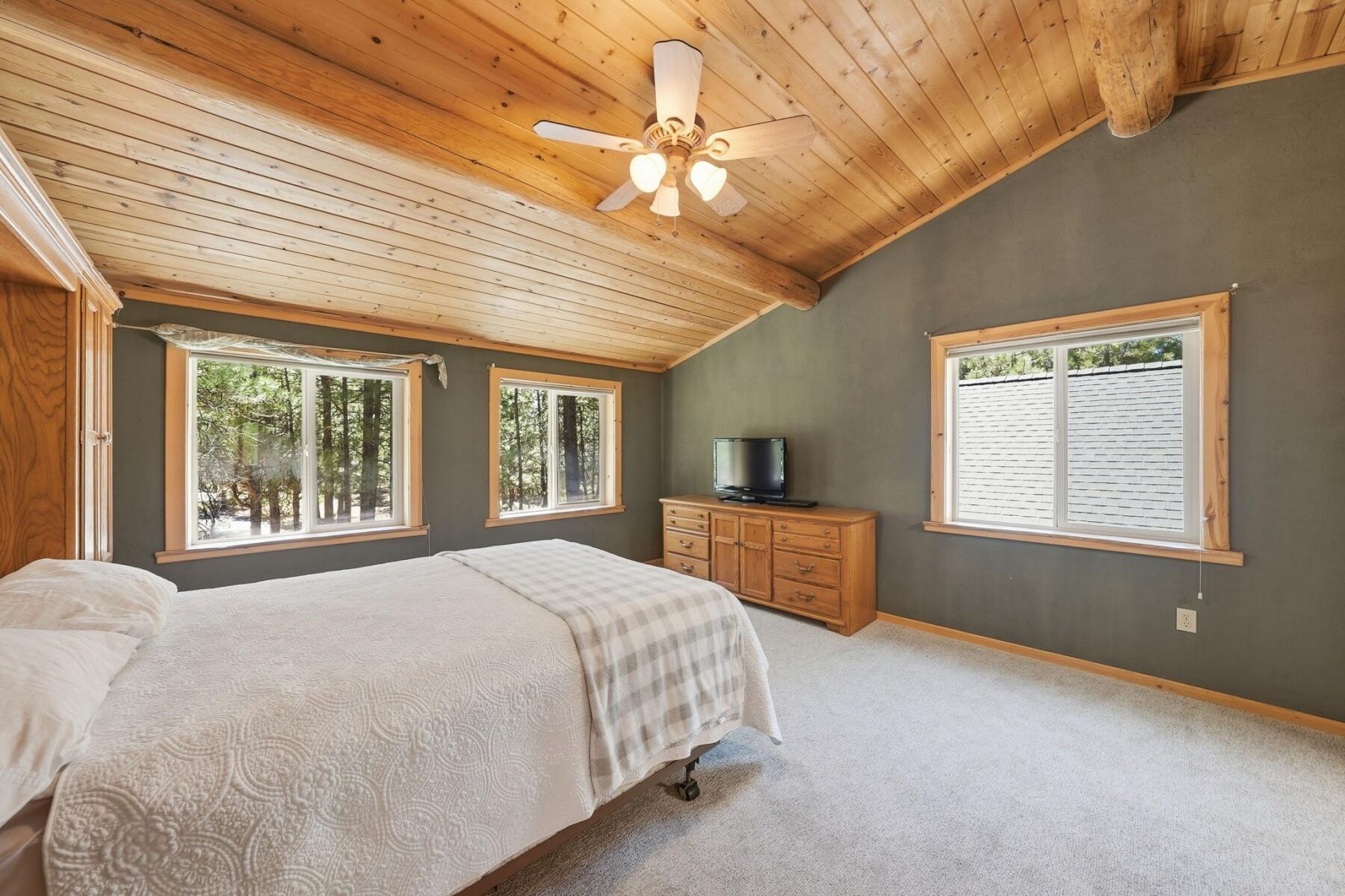 14177 Whitewater Loop La Pine, OR 97739 - Photo 16 of 38 a spacious bedroom with a large bed and a window