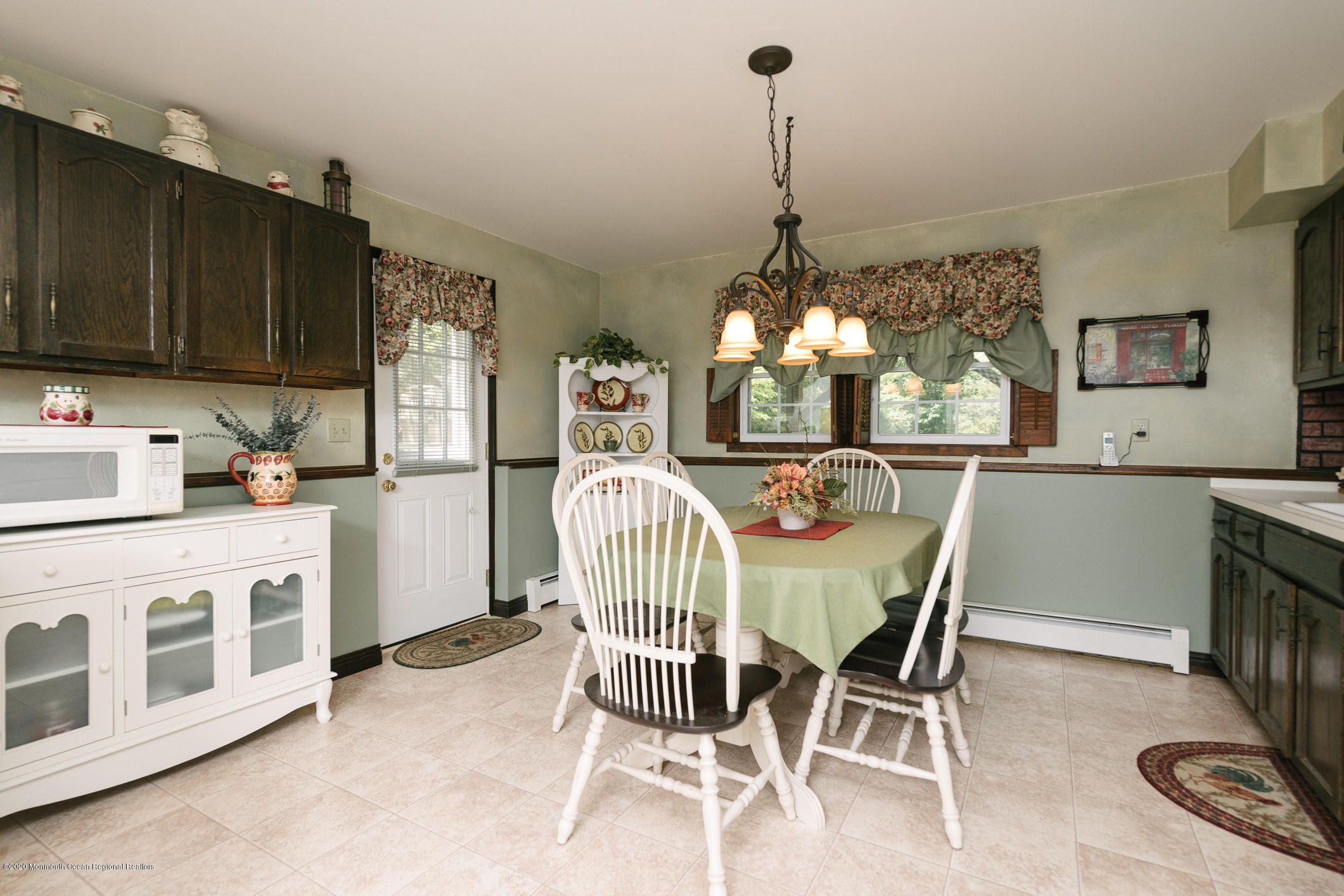 356 Cherry Quay Road Brick, NJ 08723 - Photo 20 of 31 a view of a dining room with furniture a chandelier and wooden floor