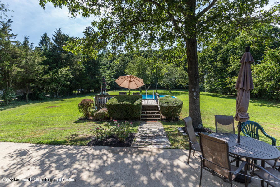 356 Cherry Quay Road Brick, NJ 08723 - Photo 25 of 31 a view of a chairs and table in the garden