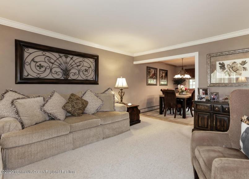 356 Cherry Quay Road Brick, NJ 08723 - Photo 6 of 31 a living room with furniture and a table