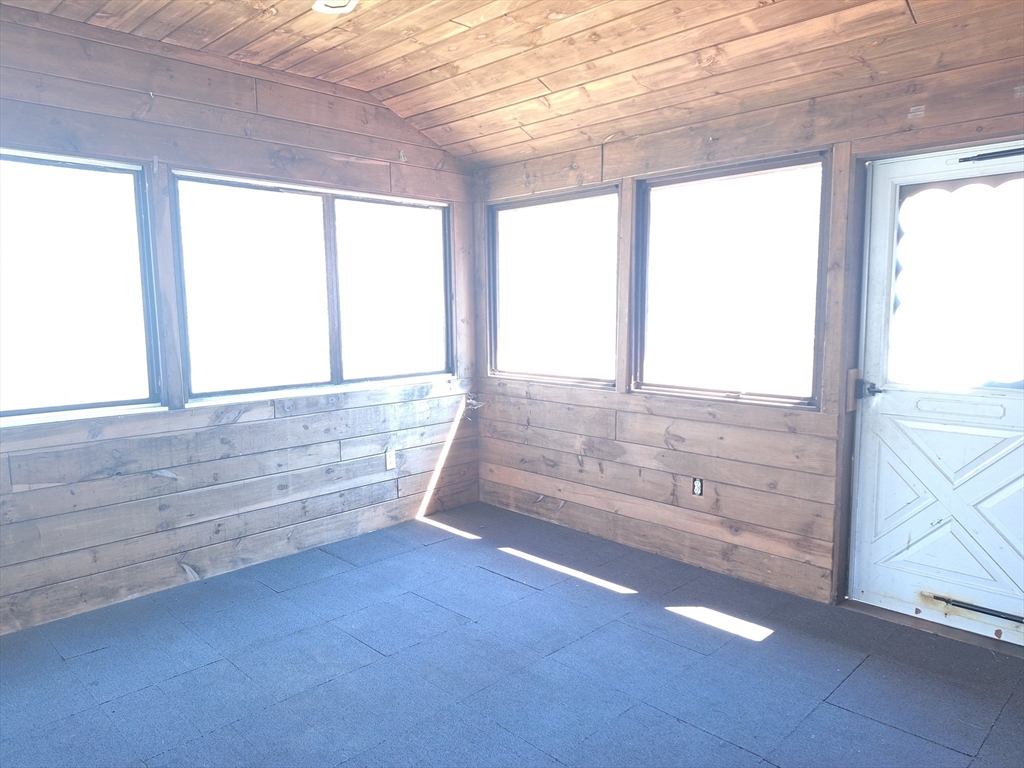 260 Hubbardston Road Princeton, MA 01541 - Photo 16 of 20 a view of an empty room with wooden floor and a window