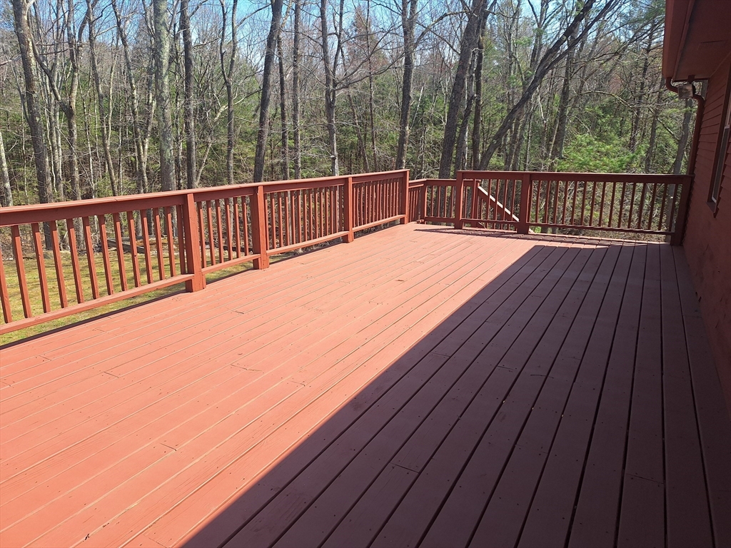 260 Hubbardston Road Princeton, MA 01541 - Photo 4 of 20 a view of balcony with wooden floor and fence