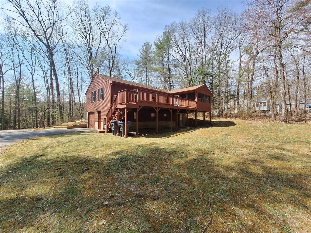 260 Hubbardston Road Princeton, MA 01541 - Photo 5 of 20 a view of a house with a yard covered in snow