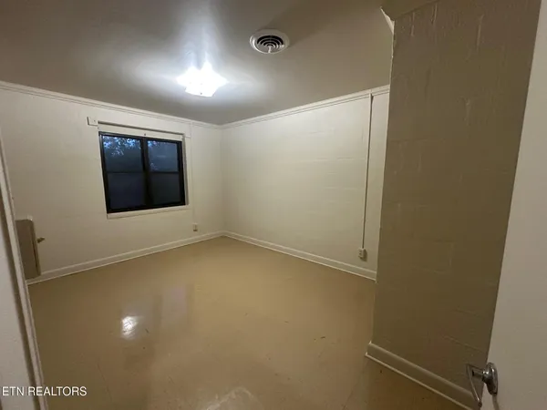 an empty room with a window