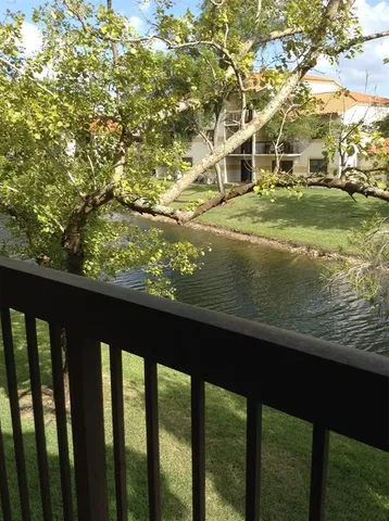 a view of swimming pool from a balcony