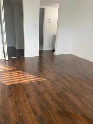 a view of a livingroom with wooden floor