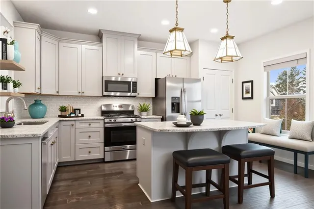 a kitchen with cabinets a sink and appliances
