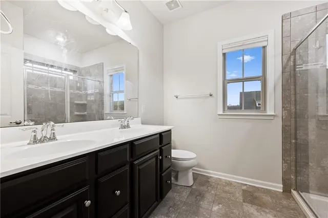 a bathroom with a shower and a toilet