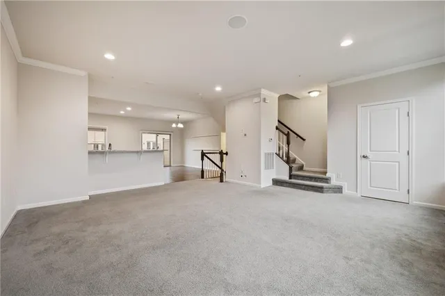 an empty room with a empty space and windows