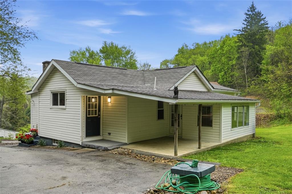 246 Highland Road Rochester, PA 15074 - Photo 5 of 44 a view of a house with a yard