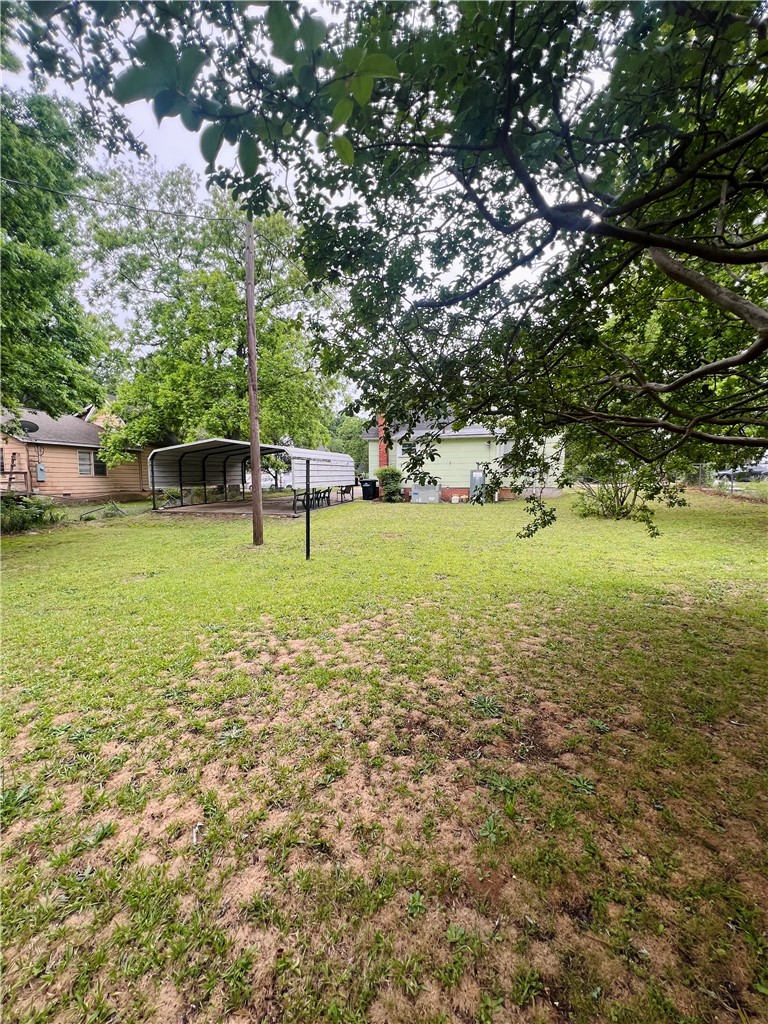 204 G Street Anderson, SC 29625 - Photo 8 of 8 A spacious backyard with mature trees provides ample room for outdoor activities.