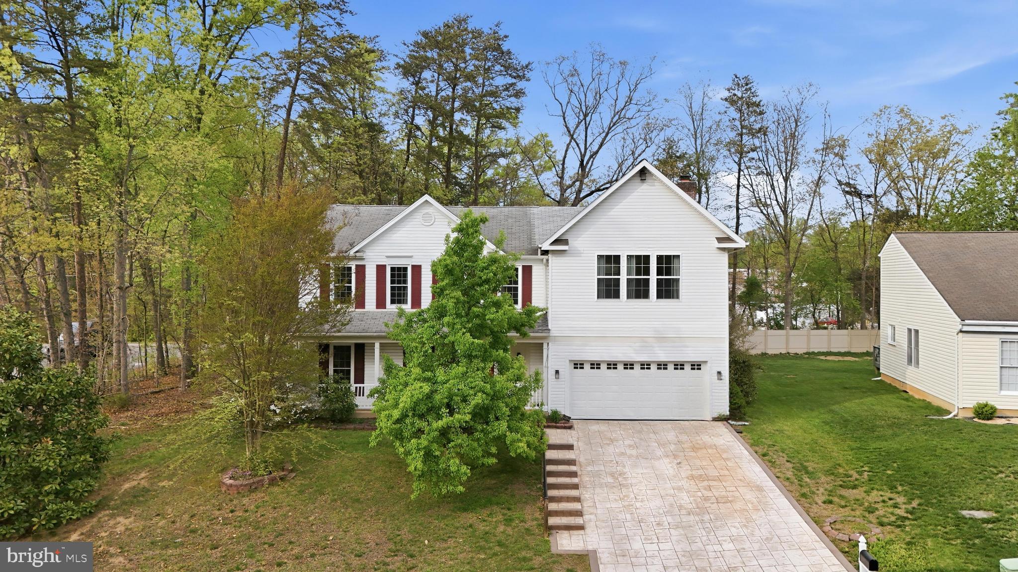 8664 Pohick Forest Court Springfield, VA 22153 - Photo 2 of 41 a view of a house with a yard