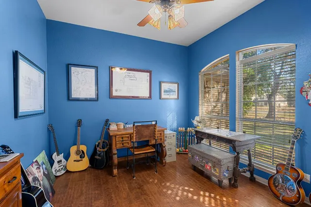a bedroom with furniture and a window