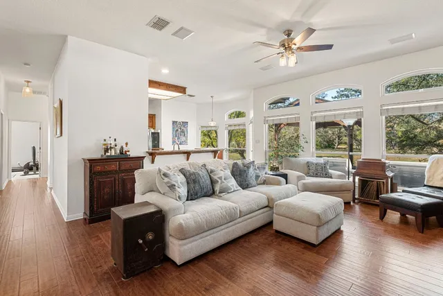 a living room with furniture and a large window