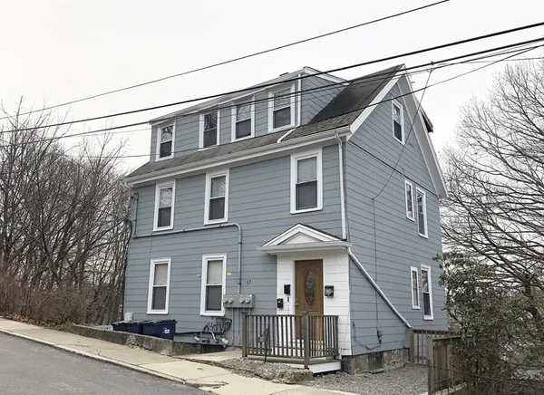 a view of a house with a street
