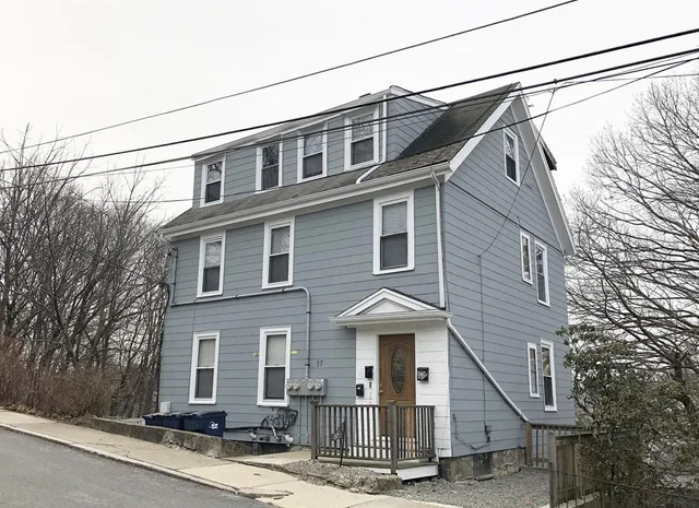 a view of a house with a street