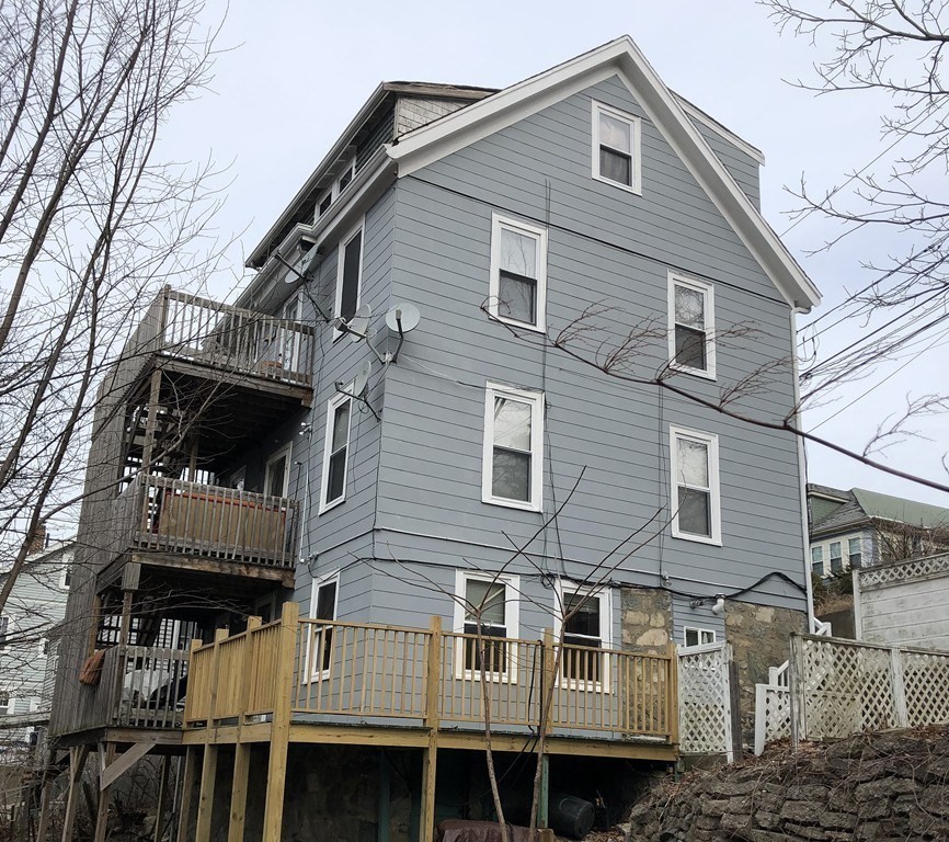 5-7 Hemman Street Boston, MA 02131 - Photo 11 of 11 a front view of a house with a garage