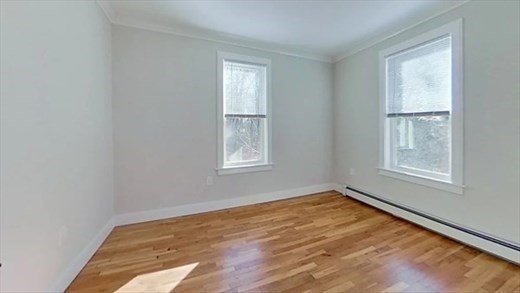 5-7 Hemman Street Boston, MA 02131 - Photo 6 of 11 an empty room with windows