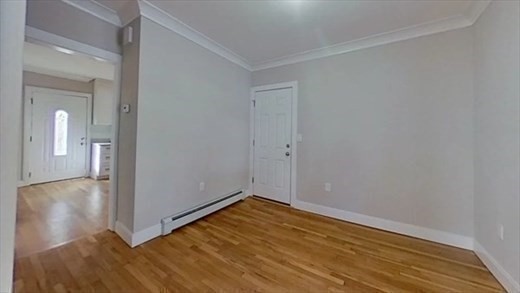 5-7 Hemman Street Boston, MA 02131 - Photo 7 of 11 a view of a room with wooden floor