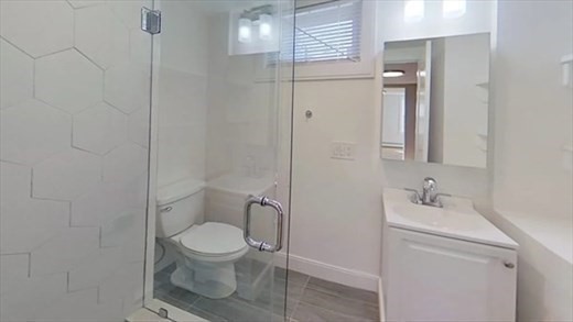 5-7 Hemman Street Boston, MA 02131 - Photo 10 of 11 a bathroom with a toilet sink and shower