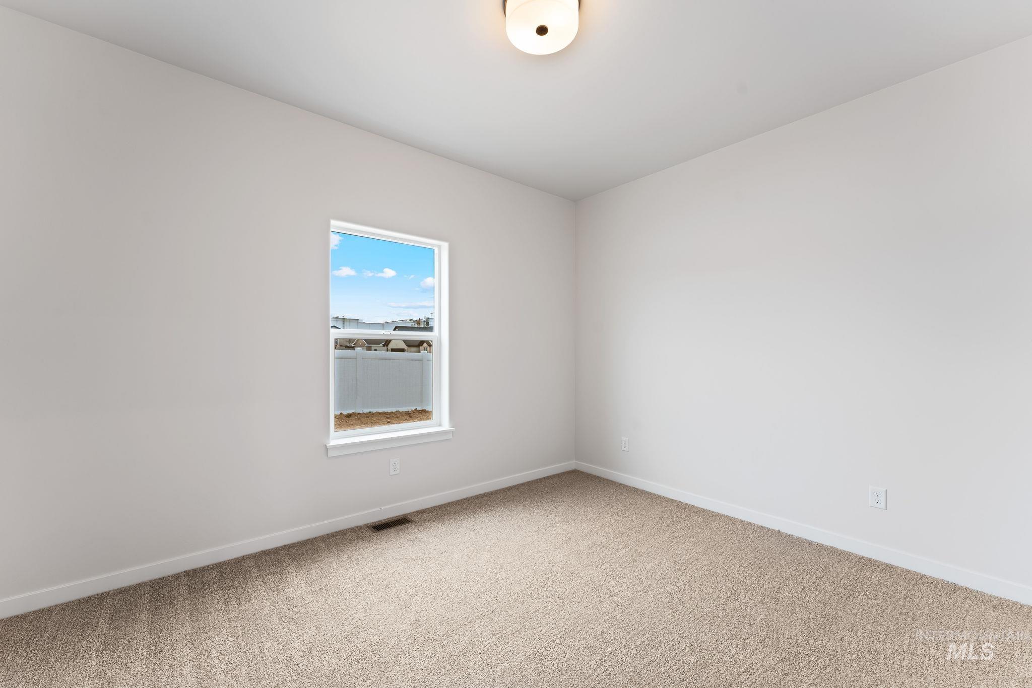 2220 Great Basin Way Burley, ID 83318 - Photo 32 of 39 Spare room with baseboards and light carpet
