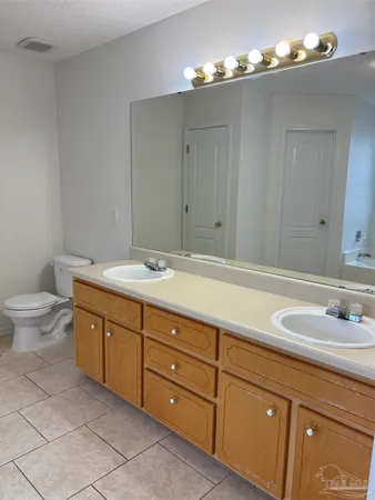 a bathroom with a sink double vanity and a mirror