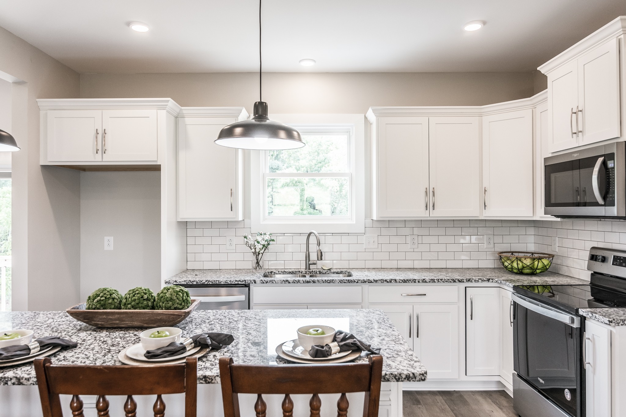 4839 Pulliam-Hardaway Road Springfield, TN 37172 - Photo 15 of 40 a kitchen with a stove and a white cabinets