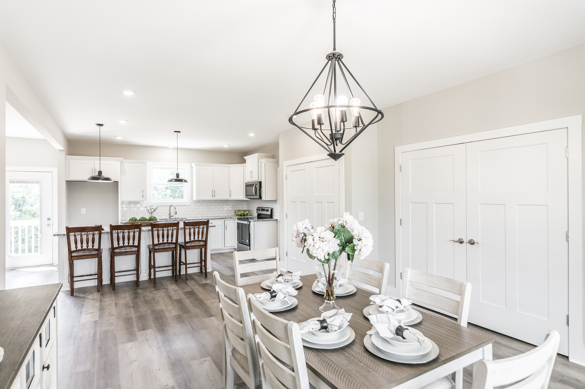 4839 Pulliam-Hardaway Road Springfield, TN 37172 - Photo 20 of 40 a view of a dining room with furniture a chandelier and wooden floor