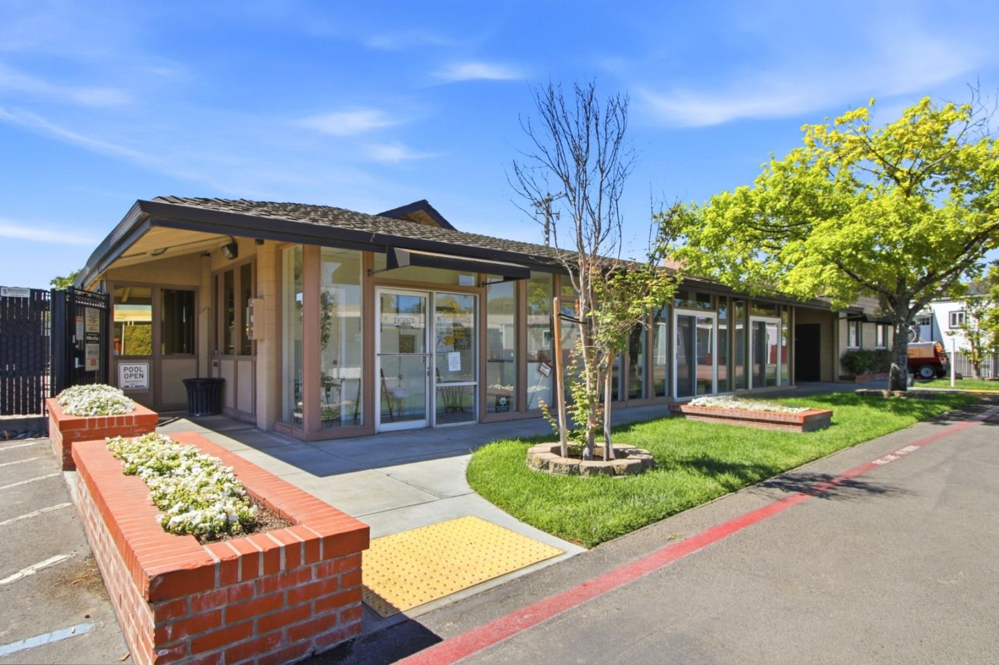 2150 Monterey Road, Unit 87 San Jose, CA 95112 - Photo 24 of 25 a front view of a house with a yard table and chairs