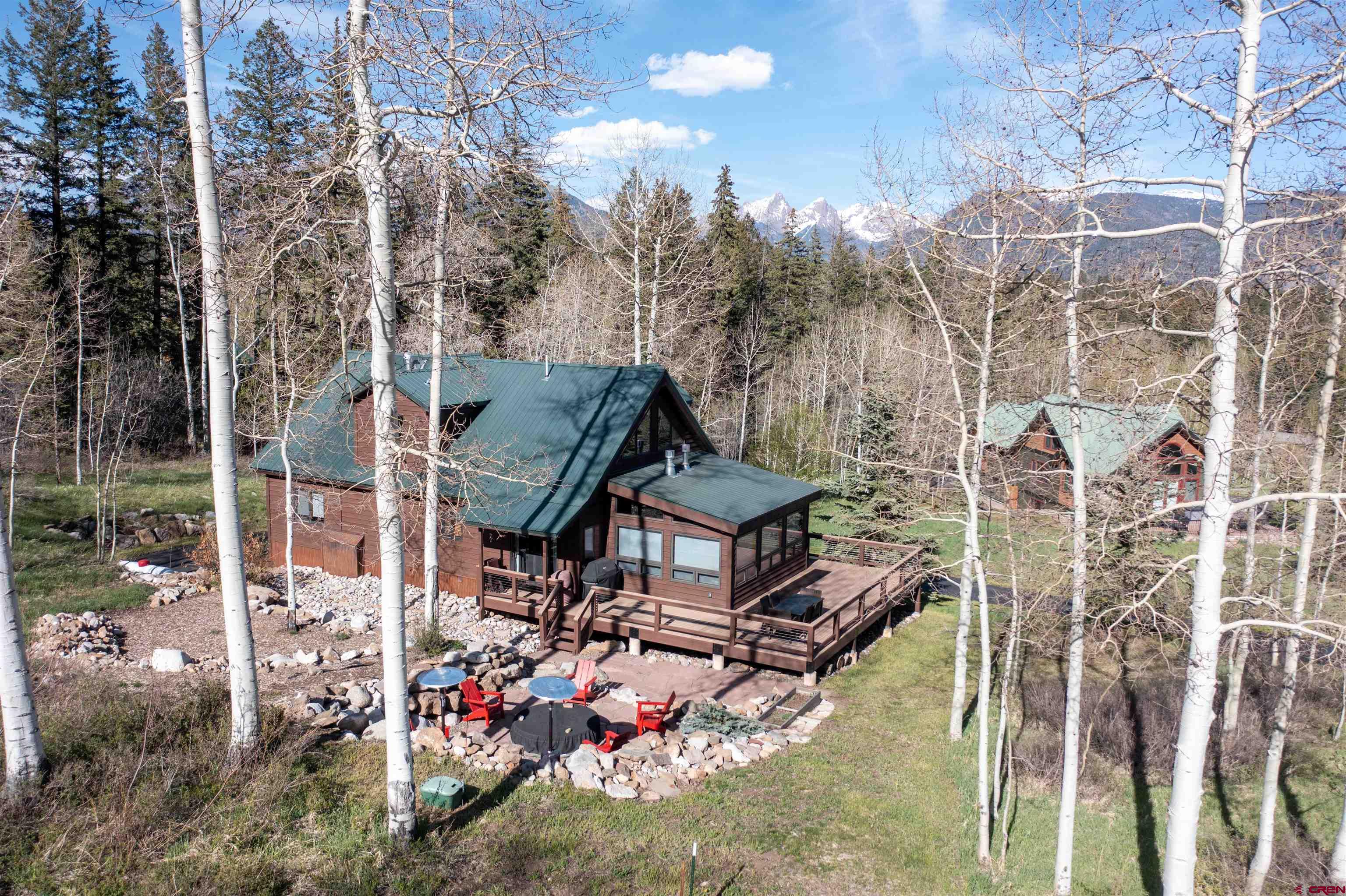 154 Falcon Ridge Road Durango, CO 81301 - Photo 38 of 42 aerial view of a house with a big yard and large trees