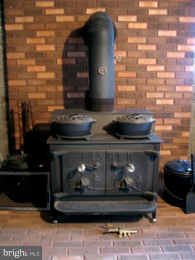 816 Hook Road Westminster, MD 21157 - Photo 16 of 30 wood stove in the lower level