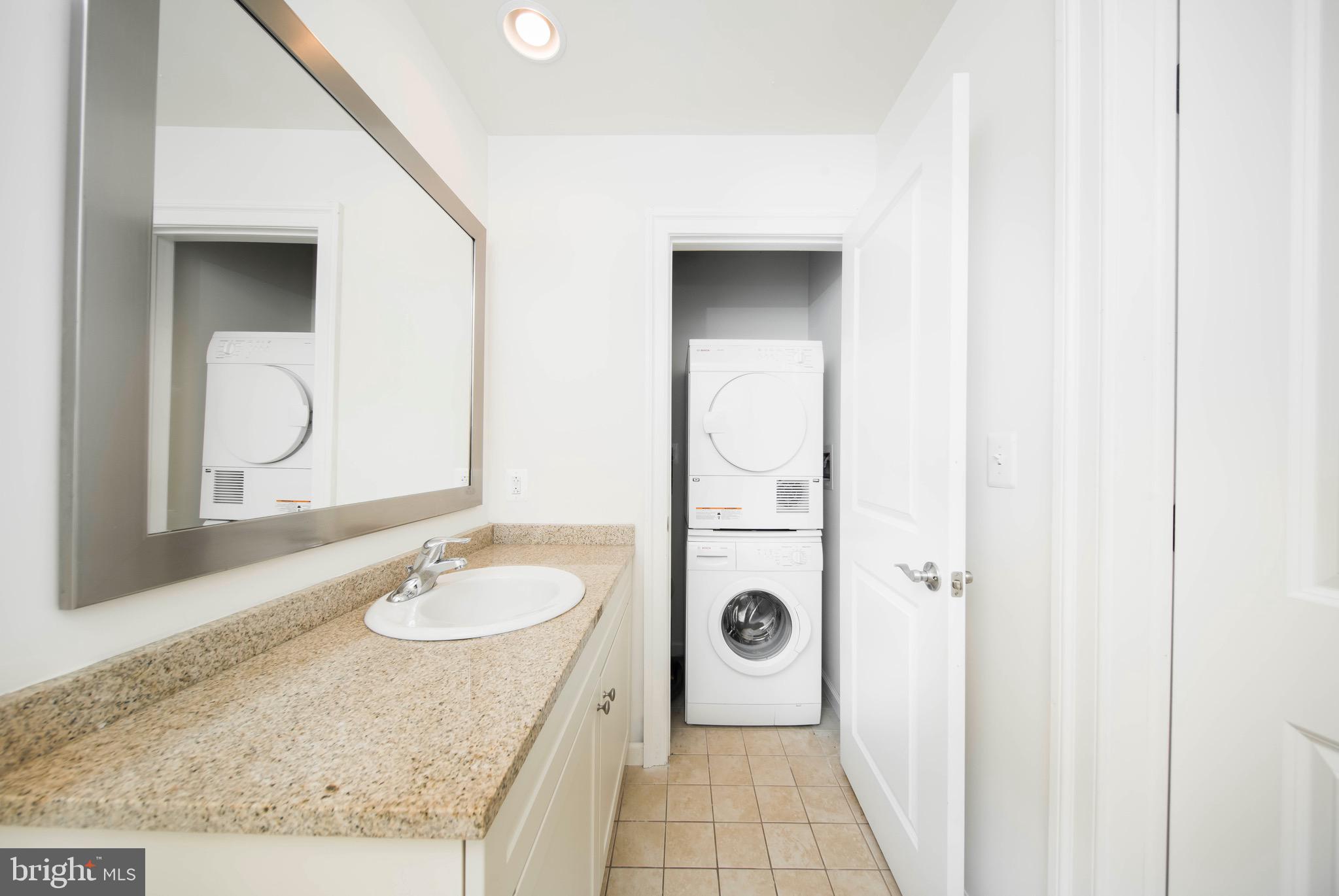 521 St Paul Street, Unit 2BR Baltimore, MD 21202 - Photo 43 of 44 a bathroom with a sink toilet and shower