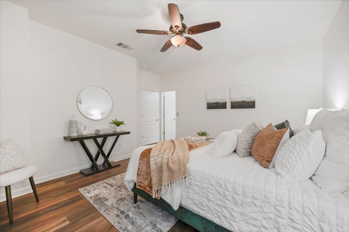 3755 Richmond Avenue Clovis, CA 93619 - Photo 17 of 30 a bedroom with a bed a dresser and wooden floor