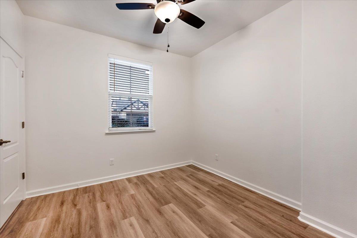3755 Richmond Avenue Clovis, CA 93619 - Photo 21 of 30 an empty room with a window and a ceiling fan