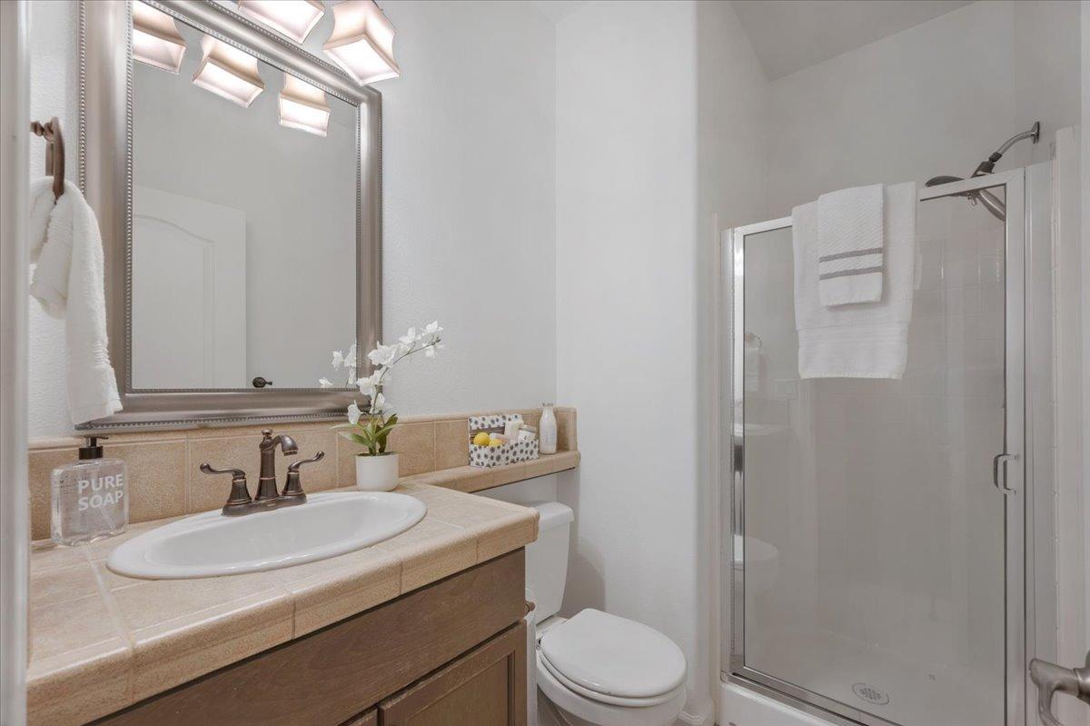 3755 Richmond Avenue Clovis, CA 93619 - Photo 23 of 30 a bathroom with a sink toilet and shower