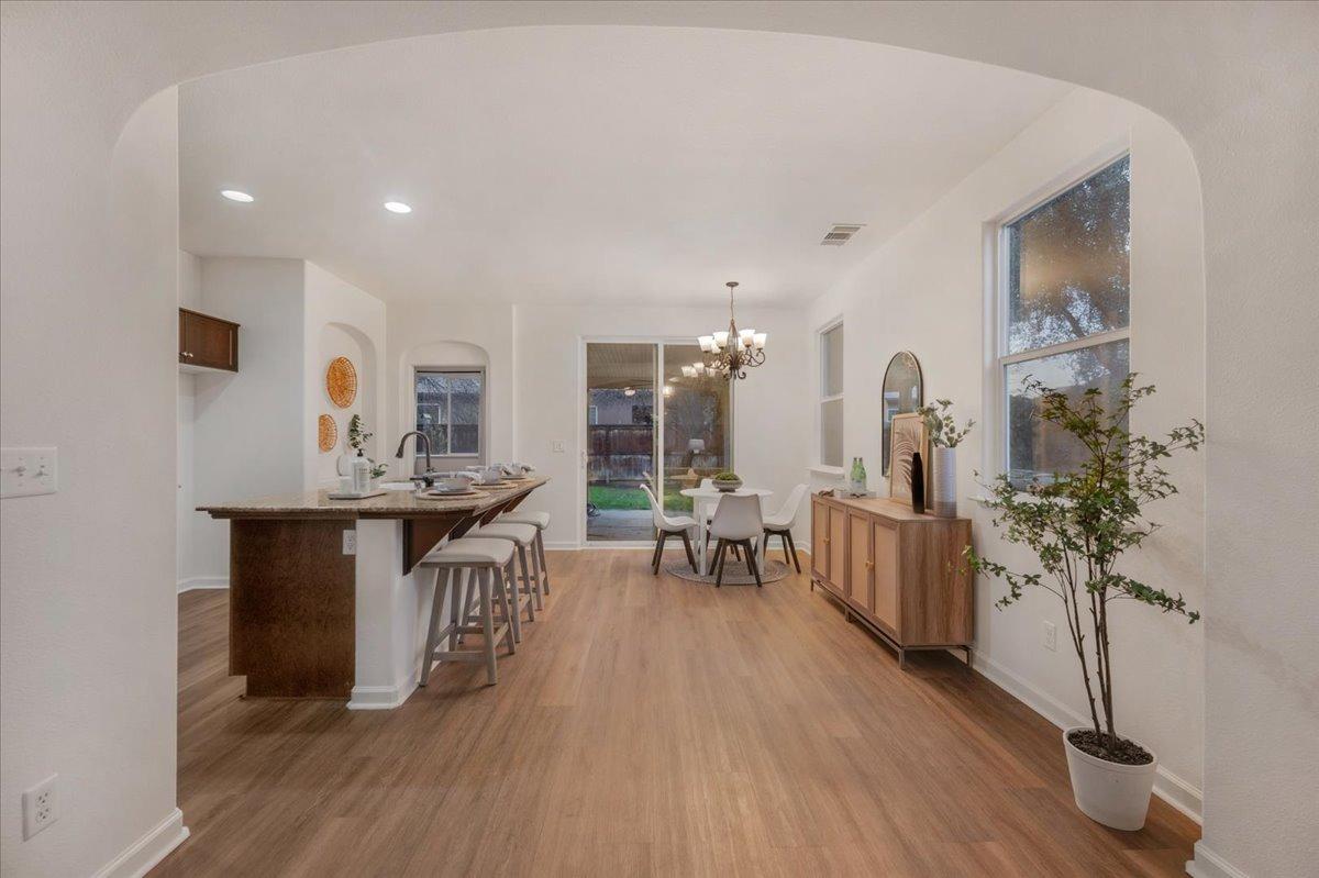 3755 Richmond Avenue Clovis, CA 93619 - Photo 6 of 30 a living room with furniture a large window and wooden floor